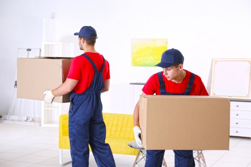 Removal team planning a flat move near Farringdon buildings