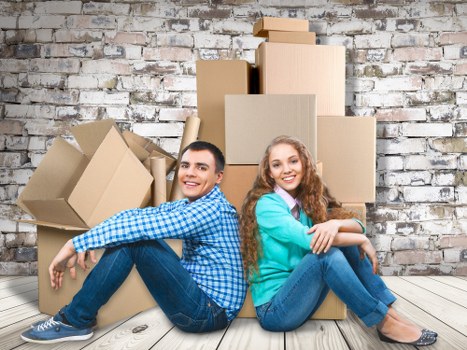 Professional movers handling apartment furniture in central London