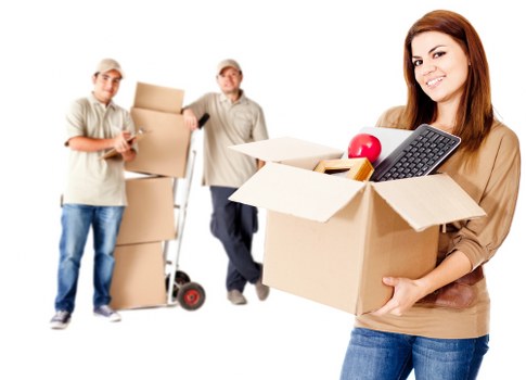 Packed boxes and furniture in a clean temporary storage unit